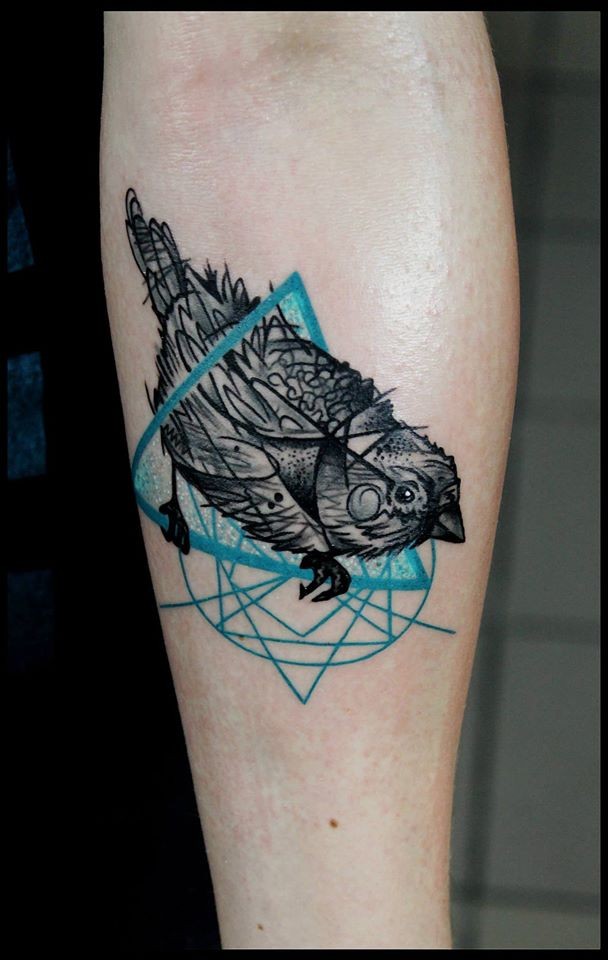 Illustrative style colored forearm tattoo of little bird with triangle