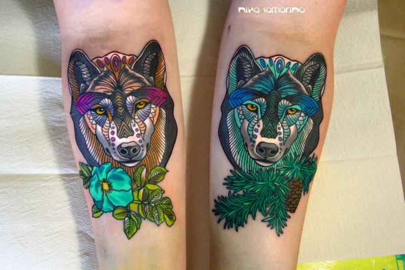 Illustrative style colored forearms tattoo of various colored wolves