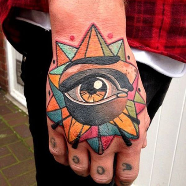 Illustrative style colored hand tattoo of fantasy star with eye