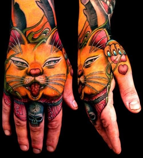 Illustrative style colored hand tattoo of sweet looking cat and red heart