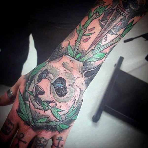 Illustrative style colored hand tattoo of panda bead with bamboo