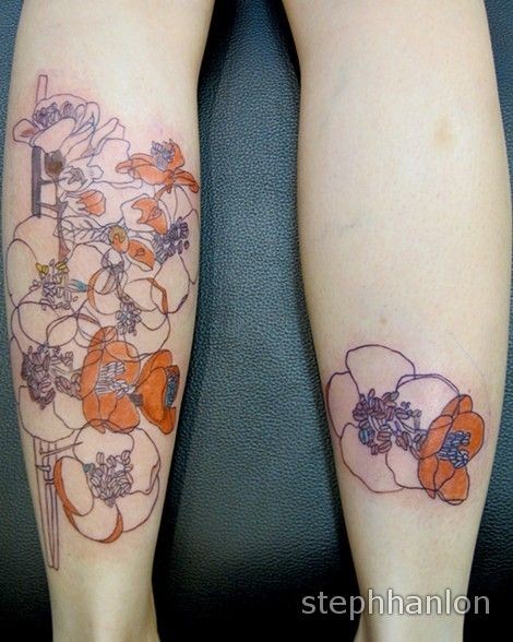Illustrative style colored leg tattoo of various flowers