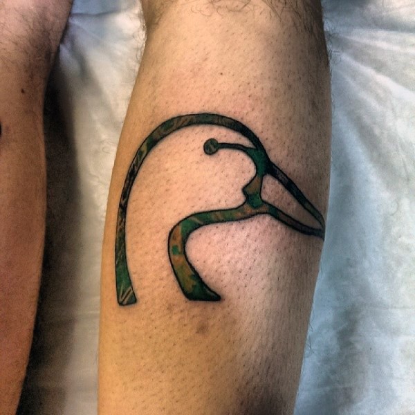 Illustrative style colored leg tattoo of swan head