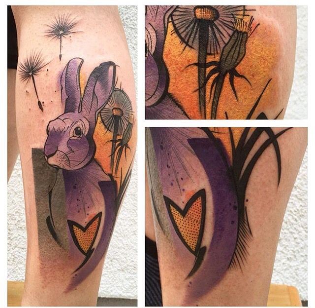 Illustrative style colored leg tattoo of rabbit with flowers