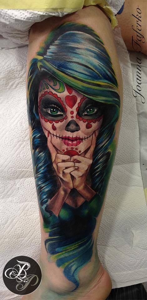 Illustrative style colored leg tattoo of Mexican woman face