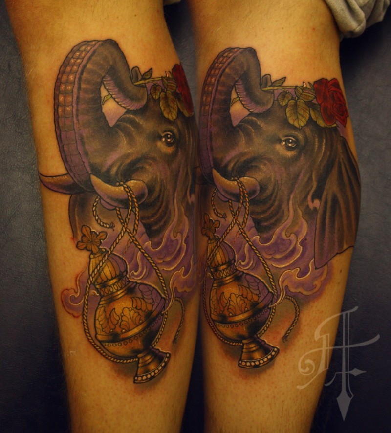 Illustrative style colored leg tattoo of big elephant with lamp