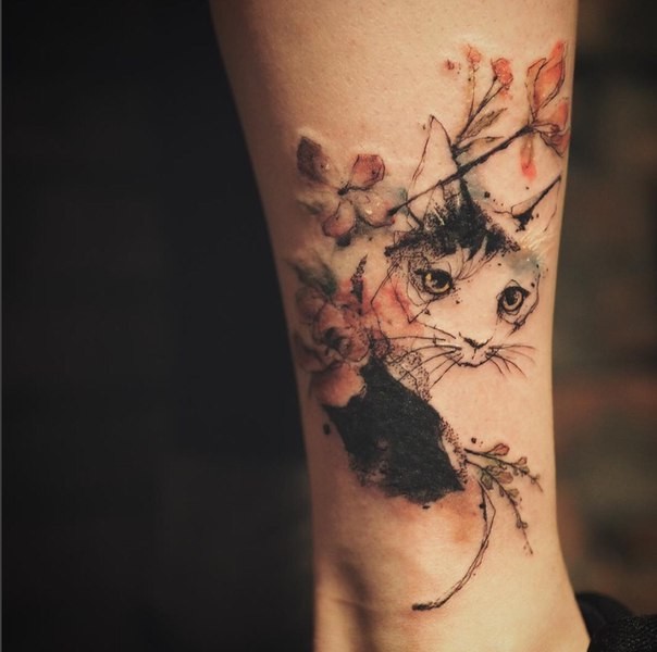 Illustrative style colored leg tattoo of cat with blooming flowers