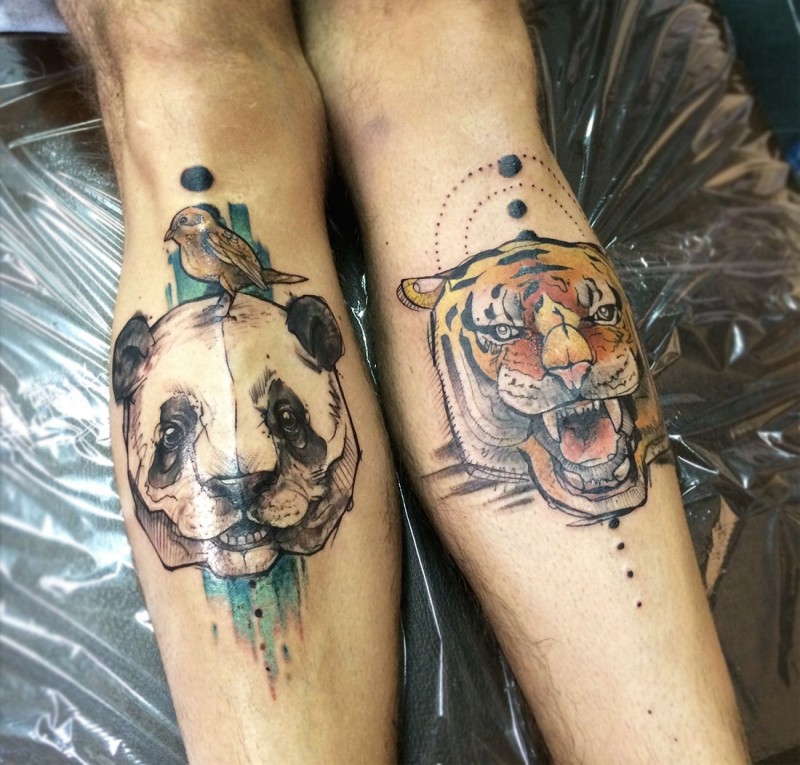 Illustrative style colored legs tattoo of tiger and panda heads