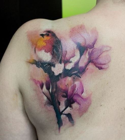 Illustrative style colored scapular tattoo of little bird with flowers