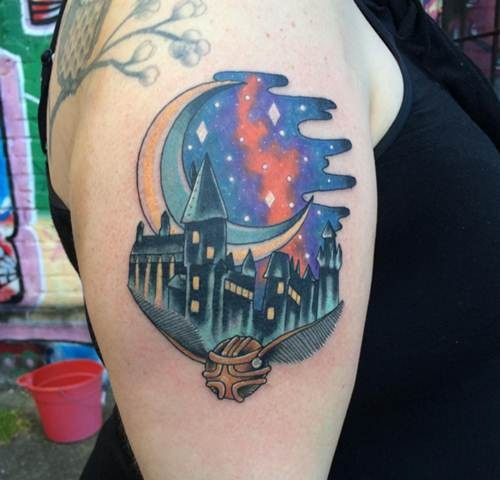 Illustrative style colored shoulder tattoo of magical school