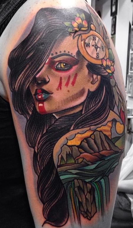 Illustrative style colored shoulder tattoo of Indian woman with compass