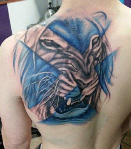Illustrative style colored shoulder tattoo of lion face with blue lines