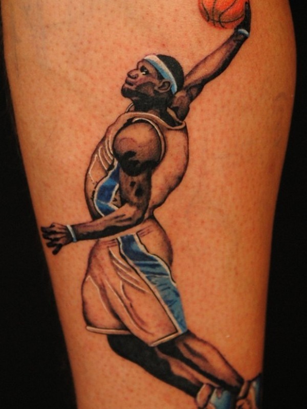 Illustrative style colored shoulder tattoo of basketball player