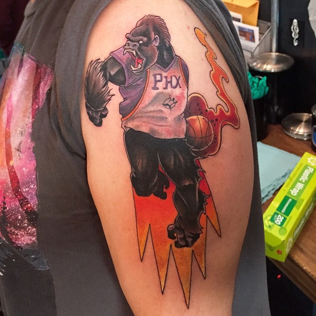 Illustrative style colored shoulder tattoo of monkey basketball player