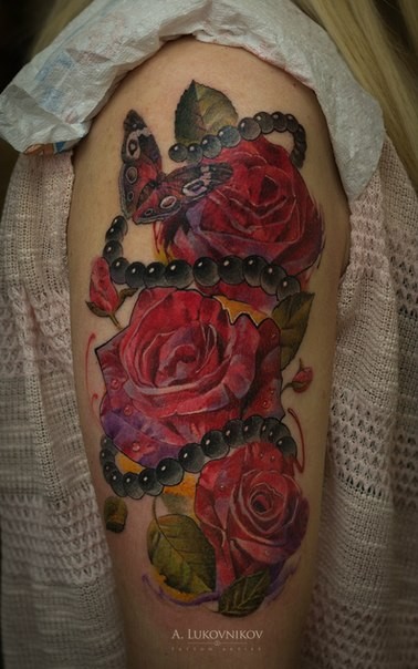 Illustrative style colored shoulder tattoo of roses with jewelry