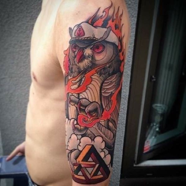 Illustrative style colored shoulder tattoo of owl with symbol