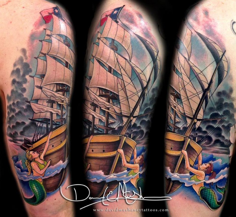 Illustrative style colored shoulder tattoo of sailing ship with mermaids