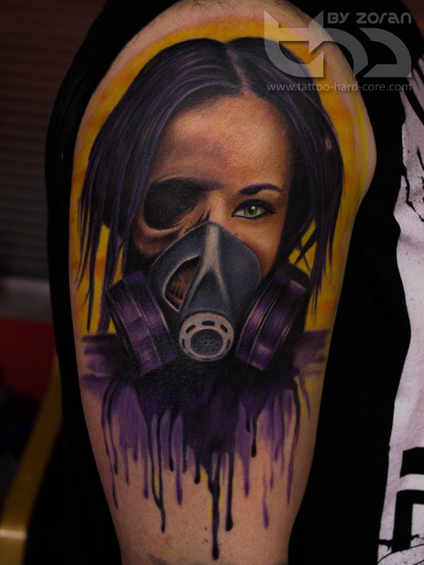 Illustrative style colored shoulder tattoo of woman with gas mask