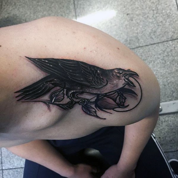 Illustrative style colored shoulder tattoo of creepy crow