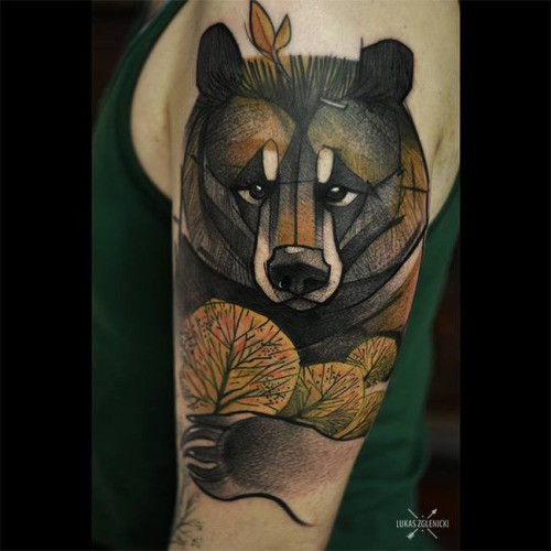 Illustrative style colored shoulder tattoo of big bear with trees