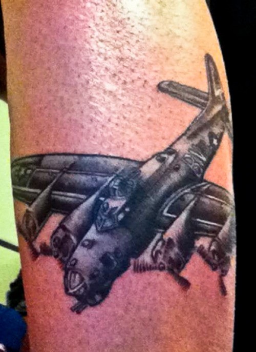 Illustrative style colored tattoo of big bomber plane