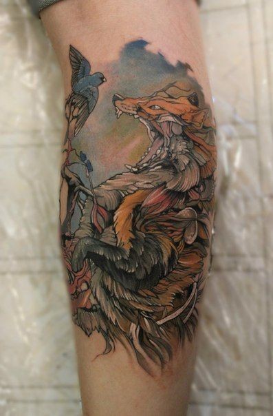 Illustrative style colored tattoo of evil fox with birds