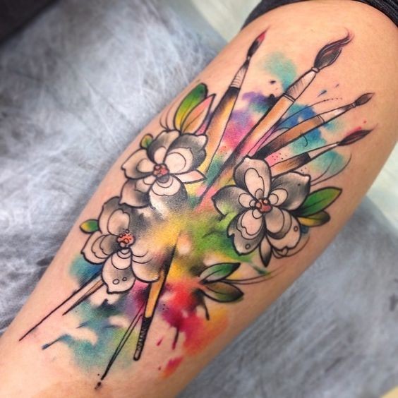 Illustrative style colored tattoo of flowers and brushes
