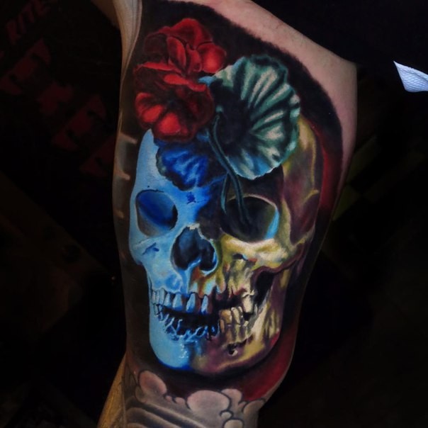 Illustrative style colored tattoo of human skull and flowers