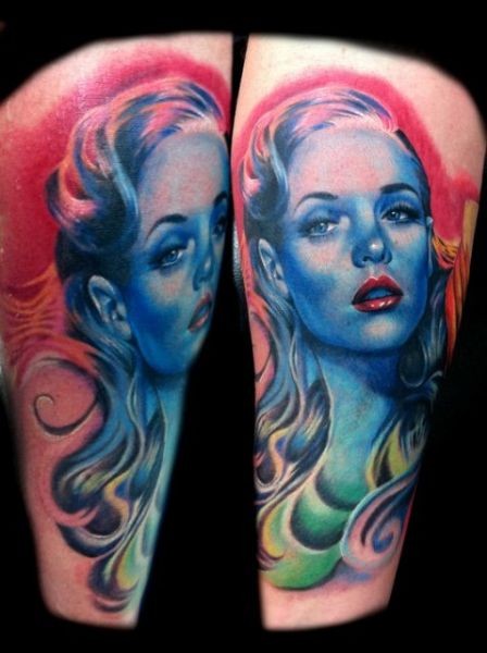 Illustrative style colored tattoo of interesting colored woman portrait