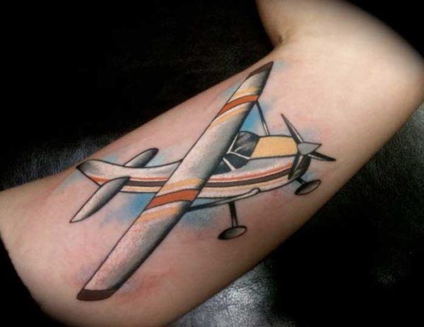 Illustrative style colored tattoo of large plane