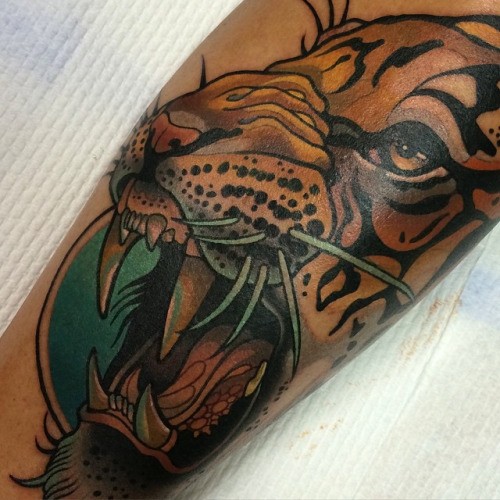 Illustrative style colored tattoo of roaring tiger