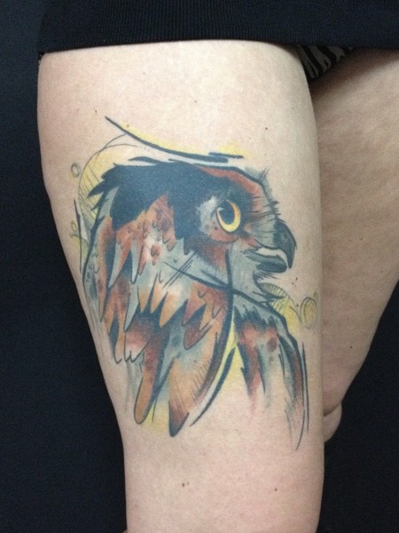 Illustrative style colored thigh tattoo of owl