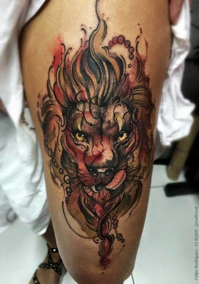 Illustrative style colored thigh tattoo of lion head