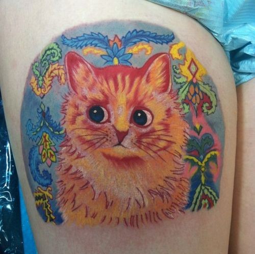 Illustrative style colored thigh tattoo of cat with feather