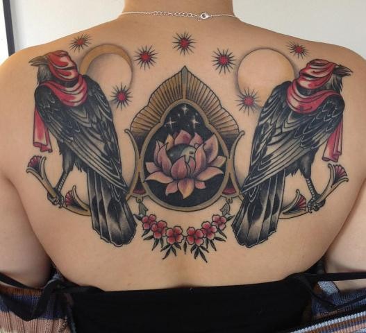 Illustrative style colored upper back tattoo of birds with flowers and symbols