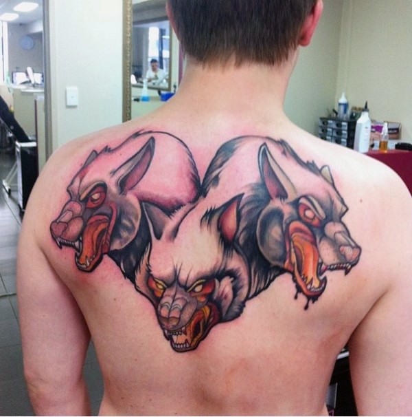 Illustrative style colored upper back tattoo of cool Cerberus