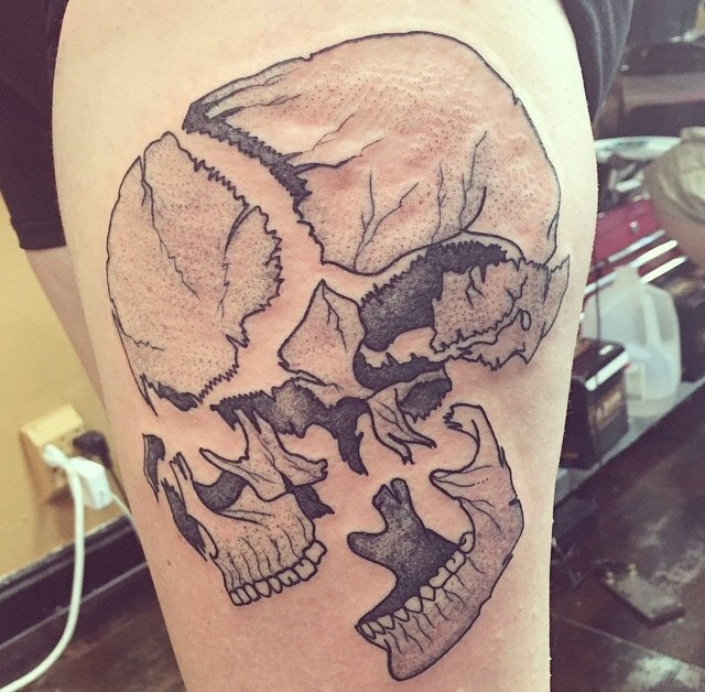 Illustrative style detailed thigh tattoo of corrupted human skull