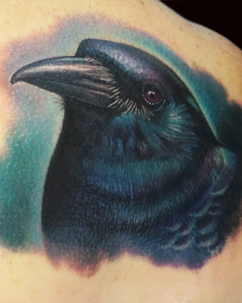 Illustrative style multicolored back tattoo of crow