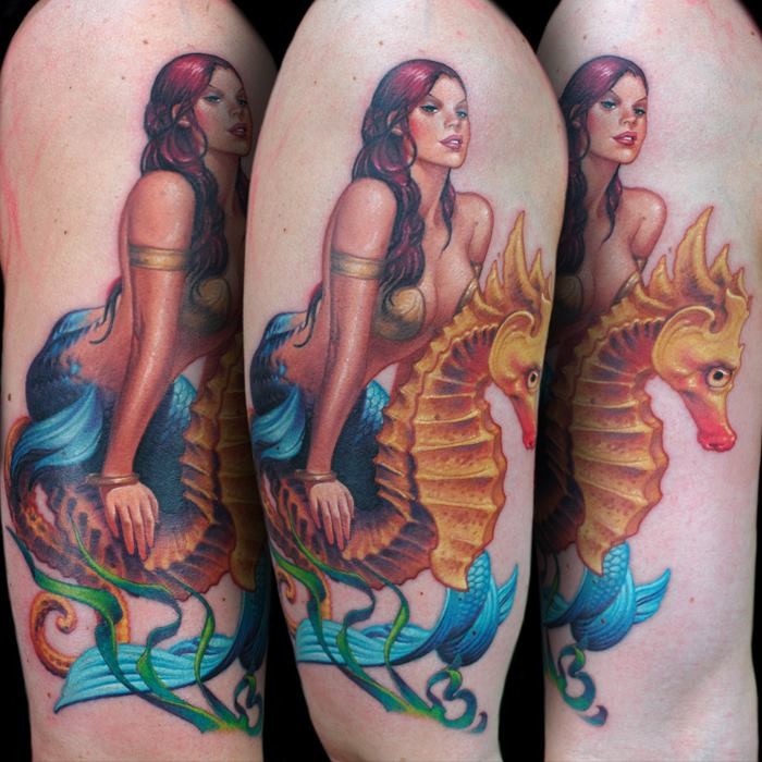 Illustrative style multicolored shoulder tattoo of mermaid with seahorse