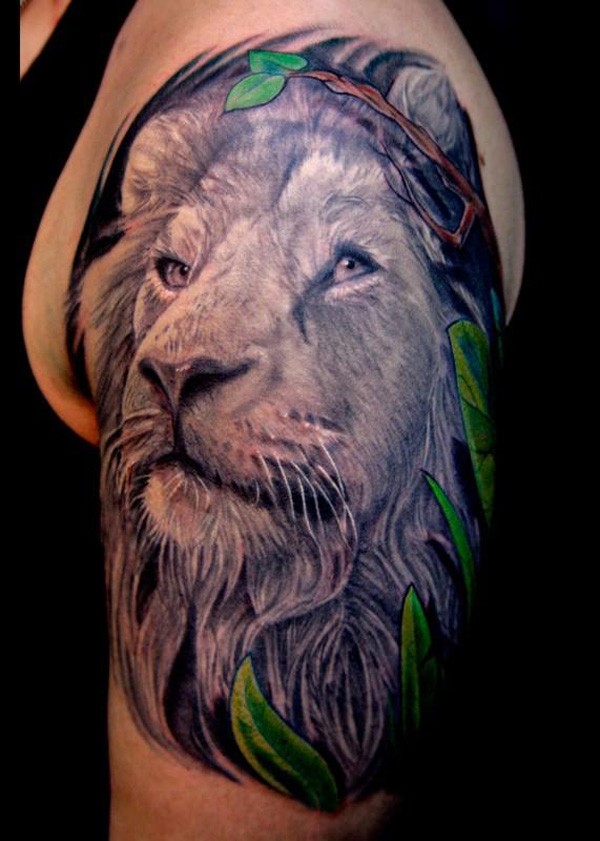 Illustrative style shoulder tattoo of lion head with jungle