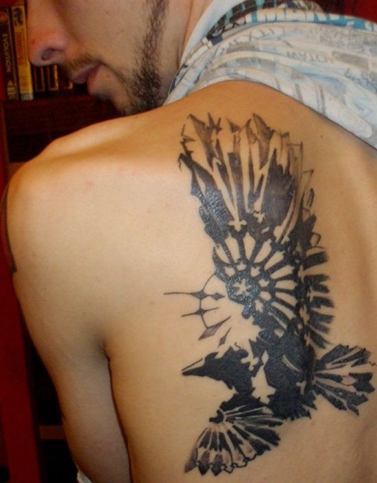Impressive abstract style black ink flying eagle tattoo on upper back