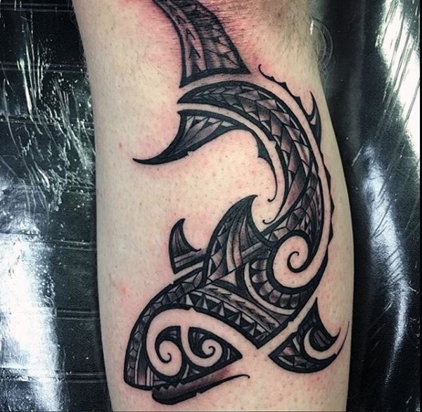 Impressive black ink leg tattoo of shark stylized with Polynesian ornaments
