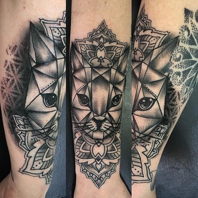 Impressive black ink steel like arm tattoo of cat with various ornaments