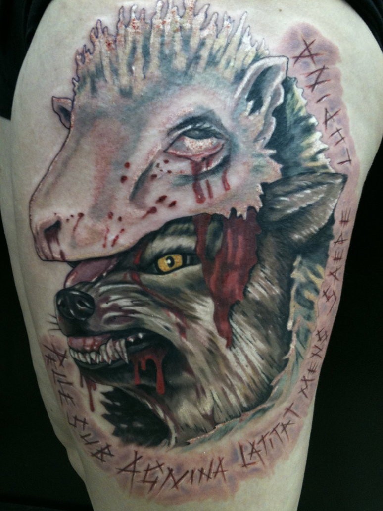 Impressive creepy looking colored thigh tattoo of bloody wolf in sheep skin
