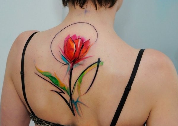 Impressive design red tulip flower colored tattoo on central back in watercolor style