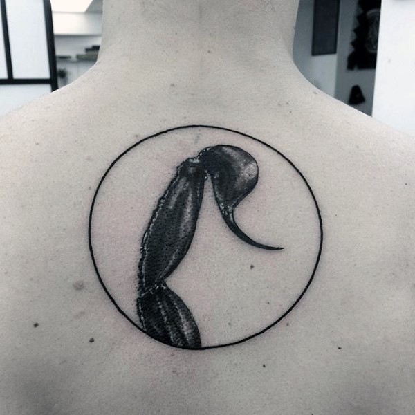Impressive designed and detailed big black ink scorpion tail tattoo on upper back