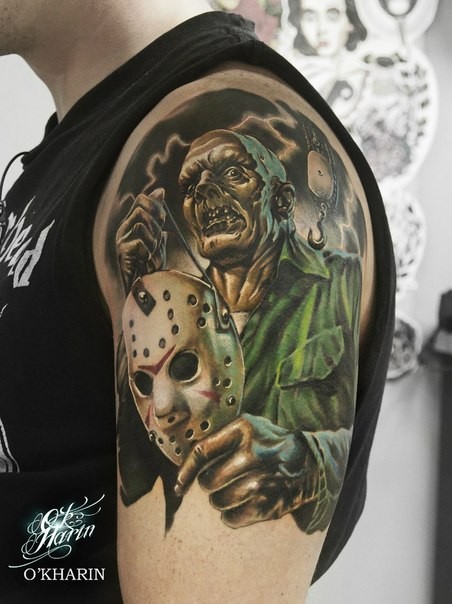 Impressive illustrative style colored shoulder tattoo of Jason maniac with mask and hook