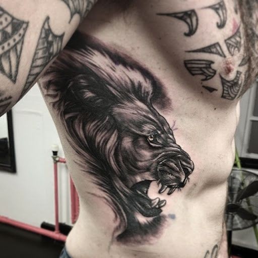 Impressive illustrative style side tattoo of roaring lion