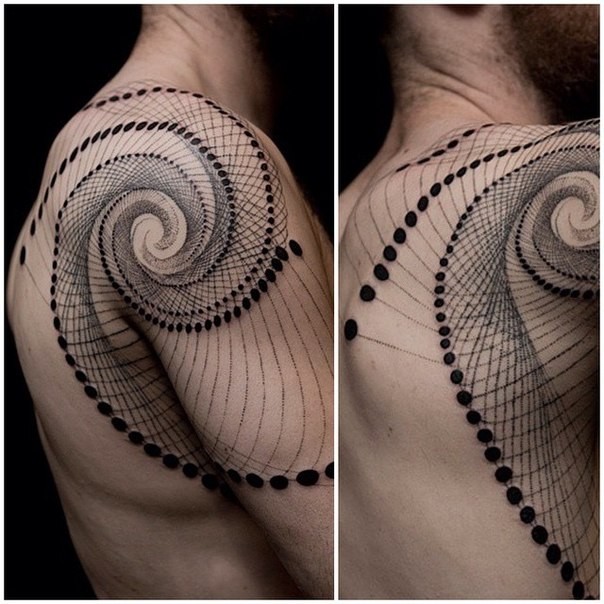 Impressive looking black ink hypnotic ornament tattoo on shoulder