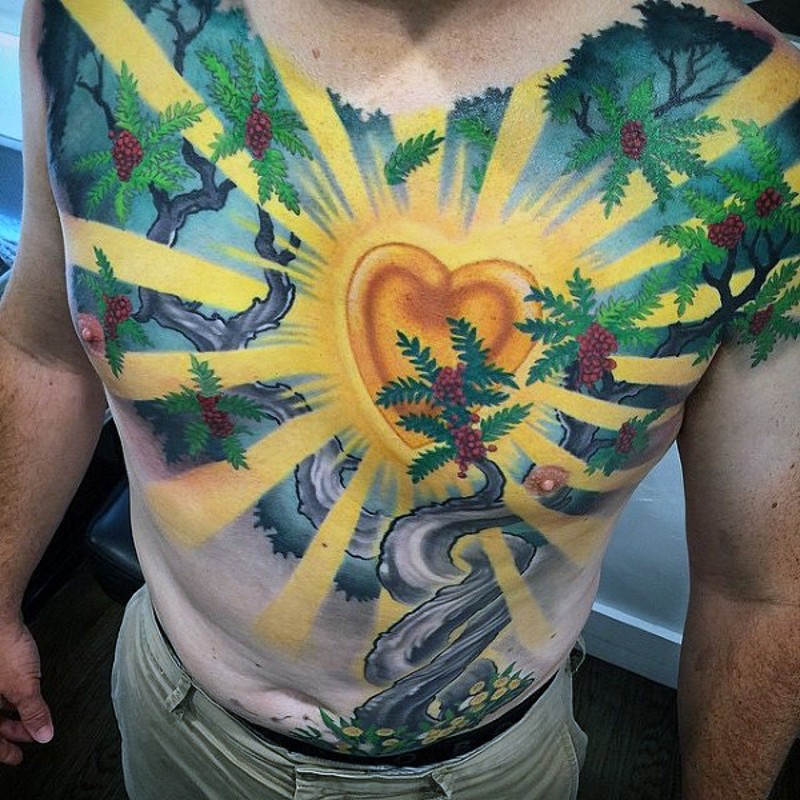 Impressive multicolored big heart in trees tattoo on chest